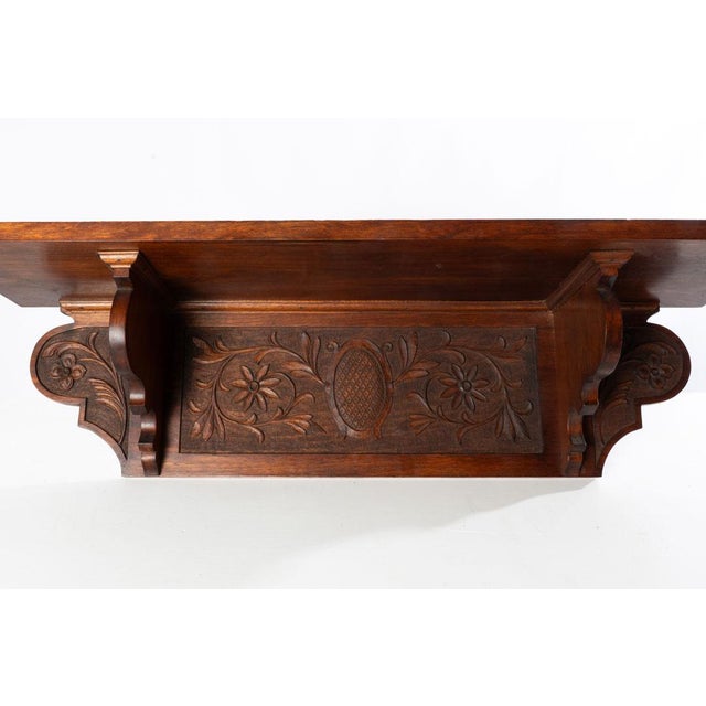 Carved shelf with detailed vine and flower design. Great for an entry way or living room to add a little extra character...