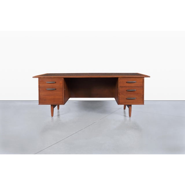Introducing a stunning mid-century walnut desk, an exceptional piece attributed to Monteverdi Young and crafted in the...