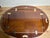 A vintage rectangular butler’s tray top coffee table with a shaped and hinged oval gallery top with hinged drop-leaf side...