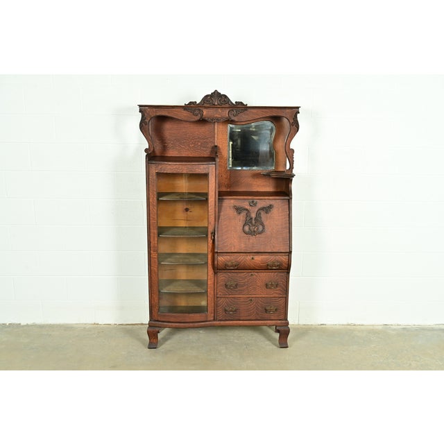A gorgeous antique Victorian side-by-side drop front secretary desk and bookcase or display cabinet By Baker Furniture...
