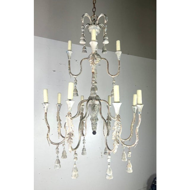 12-light Tuscan style two-tier painted chandelier by Melissa Levinson. It features a multi-tiered design with twelve...