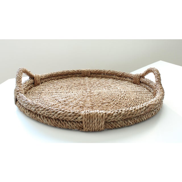 Ext Large round rattan basket tray with handles. Handcrafted by local artisans of the Philippines. This is a substantially...