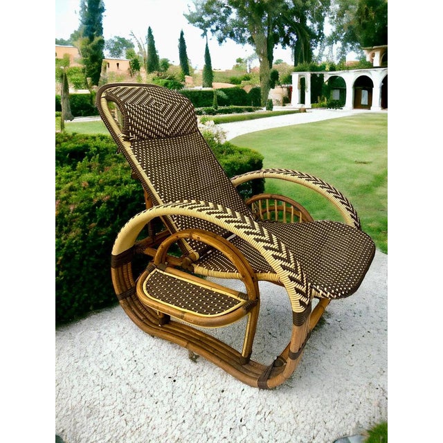 Original Mid-Century Modern reclinable Bamboo and Rattan three -stand lounge chair features stylized pretzel arms. It has...