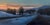 This oil painting captures a serene winter landscape, where a winding road leads through a tranquil scene bathed in the...