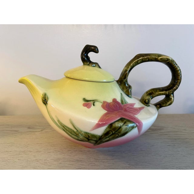 Made in the 1950's, this 5-piece set of beautiful Hull art pottery of the Woodland design features a large teapot,...