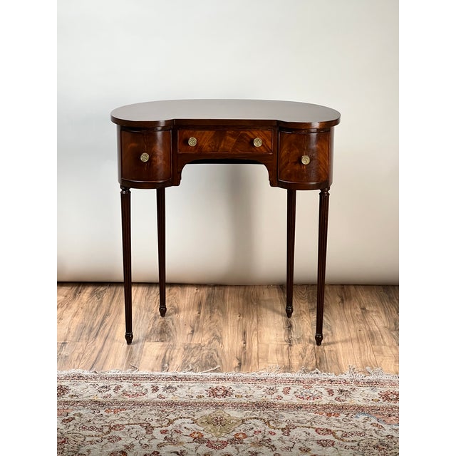 This elegant vintage dressing table was crafted in the Edwardian Sheraton Revival style around 1940, drawing inspiration...