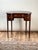 This elegant vintage dressing table was crafted in the Edwardian Sheraton Revival style around 1940, drawing inspiration...