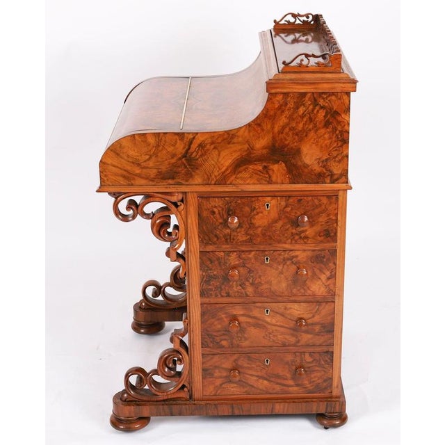 This is a gorgeous antique Victorian piano front Davenport Desk, Circa 1860 in date. It is crafted from fabulous burr...