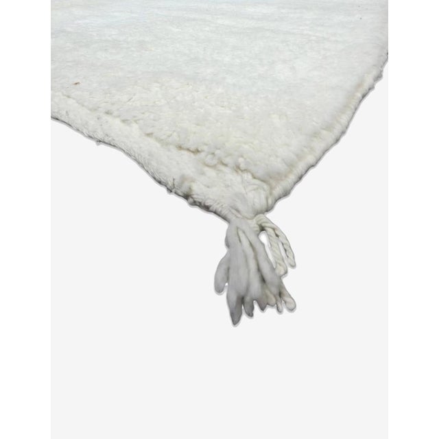 Modern Boujad Rug | Handwoven Wool Rug in Solid Undyed Ivory This modern Boujad rug takes a quietly minimal approach,...