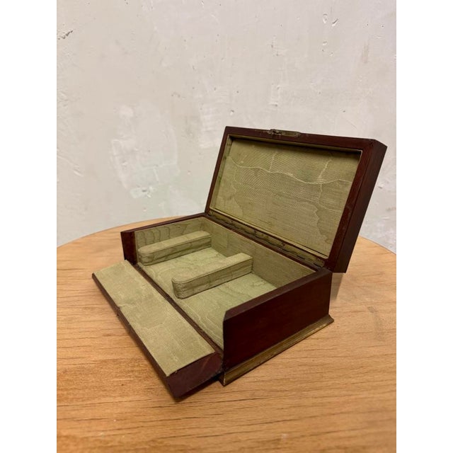 Oak jewelry box, bronze rod, fabric lining.