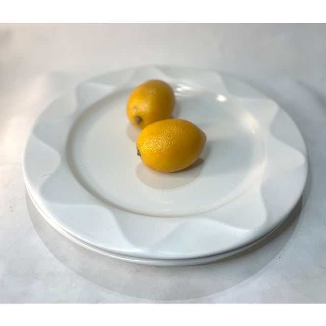 This is a striking pair of oversized "chop plates" or round platters from Dansk's Origami collection. Featuring a...
