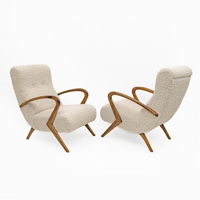 This pair of Italian armchairs captures the essence of mid-20th century modern design, attributed to Paolo Buffa. Made...