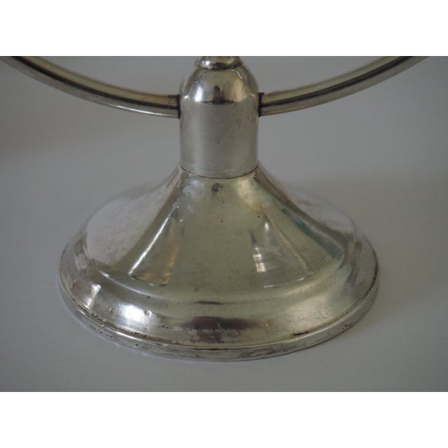 A gorgeous pair of Raimond Sterling weighted double branched candlesticks. The Raimond Silver Manufacturing Company...