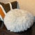 Round pillow with long fuzzy vegan fur perfect for a chalet setting. The pillow is overstuffed so that it may be used as...