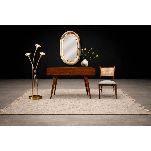 A striking sculptural floor lamp from the 1960s, designed as a stylized cluster of bamboo shoots rising organically from a...