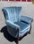 Elegant and substantial, this vintage wingback lounge chair showcases timeless craftsmanship with a beautifully carved...