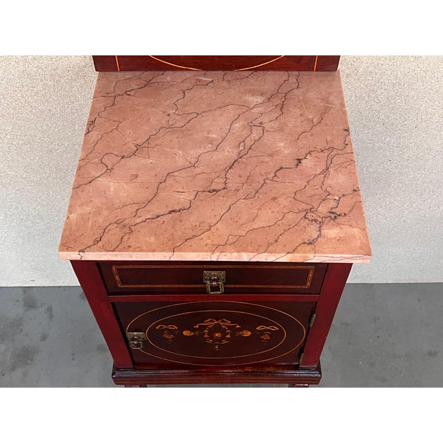 Louis XVI style pair of Marquetry nightstands with wood and mirror crest with shelveone drawer and one compartment....