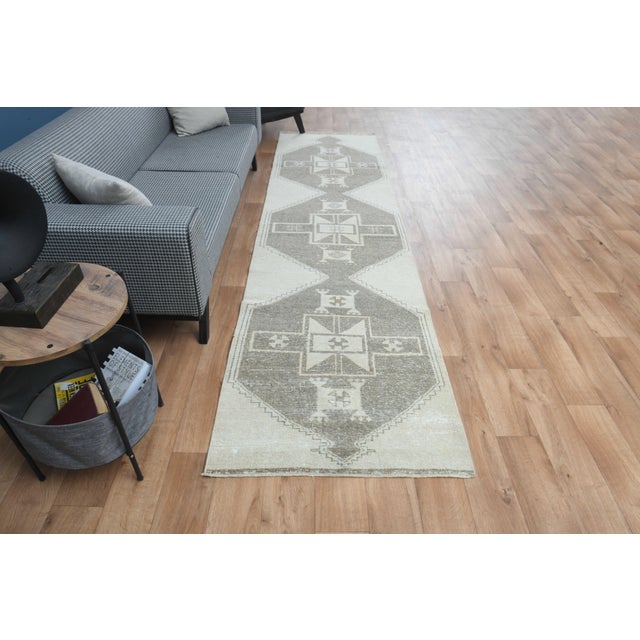This vintage hand-knotted area rug is a semi-antique vintage area rug. The '70s Eastern region of Anatolian's unique rug...