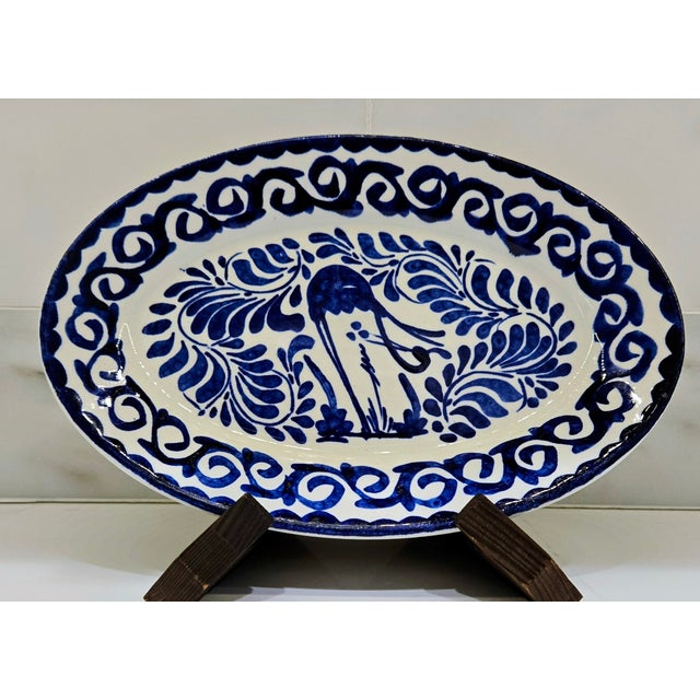 Celebrate classic Mexican design with this Anfora Mexico blue and white oval ceramic platter, marked “Hecho en México /...