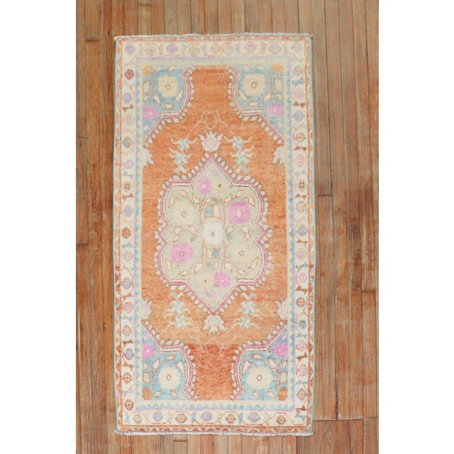 Mid-20th Century Turkiish anatolian rug featuring a bright orange color. Measures: 2'10" x 5'3".