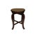 This antique-style stool features a circular, well-worn leather top that boasts a deep, cognac-colored patina. The surface...