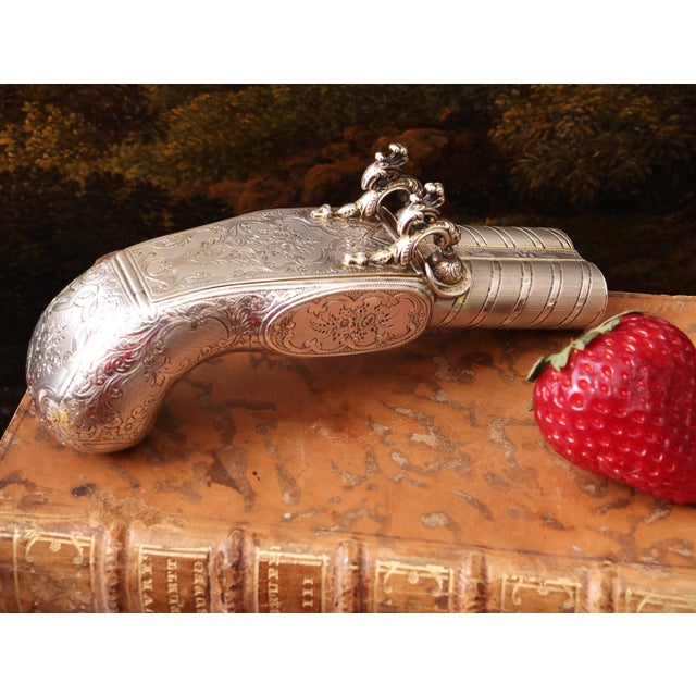 Gun-shaped silver vermeil snuff cigarette box France, early 20th century. Crafted in the shape of a pistol, entirely...