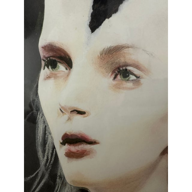 This is a very unique woman's portrait painted with color pencils over a black board and intentionally hand cut. It looks...