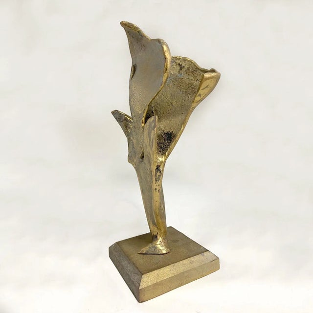 Abstract bronze cast sculpture of bird about to fly, spreading its wings. The sculpture is Expressive in a brutalist...
