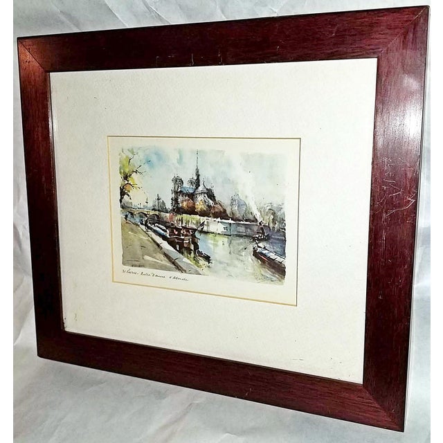 This 1950s Paris print of a watercolor of Notre Dame originated from the sidewalk sellers along the Seine in Paris, the...