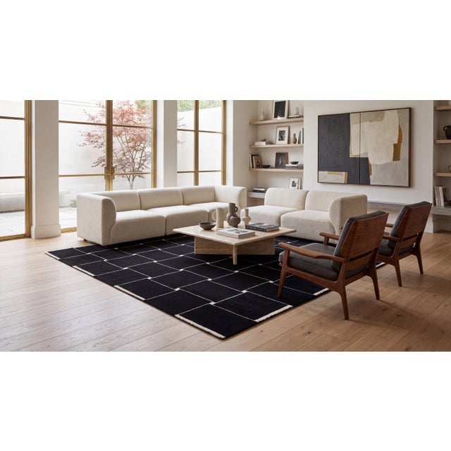 A commanding statement piece defined by graphic precision and quiet luxury. Inspired by modernist grid architecture, this...