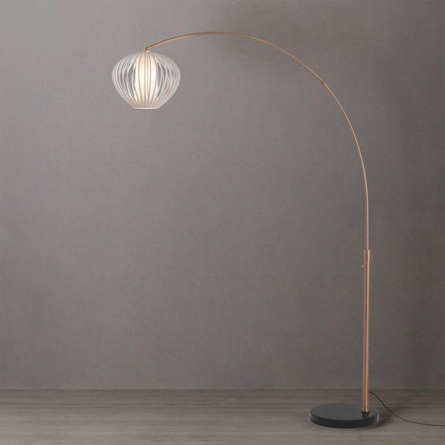 The Float Arc Lamp is a striking piece in the Arc Lamps category, featuring a weathered brass steel frame with a sphere...
