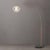 The Float Arc Lamp is a striking piece in the Arc Lamps category, featuring a weathered brass steel frame with a sphere...