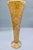 A striking trumpet-form vase built from individually applied glass tiles in champagne gold, with flecks of iridescent...