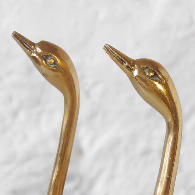 Four brass figures in the shape of a swan, they are quite heavy (almost two kilos in total) 70s Height: between 13 and 21 cm