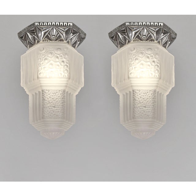 Francis Hubens & Muller frères A pair of French art deco flush mounts by Francis Hubens. Made circa 1931- 1934. Nickel-...