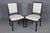 This set of eight French Louis XVI style dining chairs, finished in an elegant ebonized black lacquer, is a superb example...