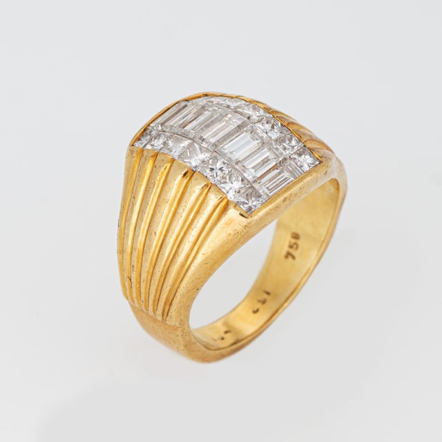 Stylish diamond dome band crafted in 18 karat yellow gold (circa 1970s). Mixed cut princess and straight baguette diamonds...