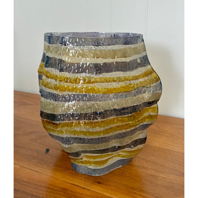 Organic shaped, textured glass vases hand painted with horizontal stripes.