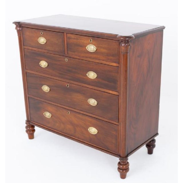 A handsome Victorian mahogany chest of drawers, standing upon elegant ring-turned feet Circa 1860 The chest is arranged...