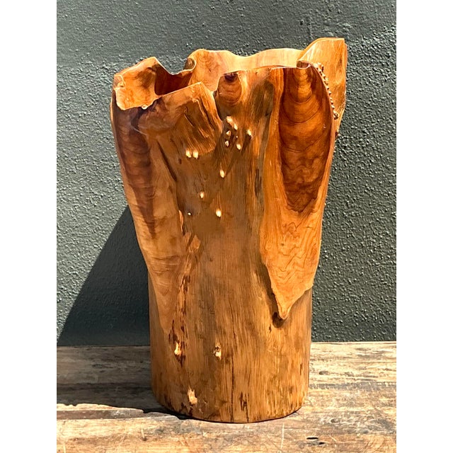 This monumental carved wood vase is a masterwork of Organic Modernism, celebrating the raw, untamed beauty of natural...