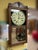 High-quality oak cabinet construction; quartz time-only mechanism with simple calendar and swinging pendulum; circa 1980;...