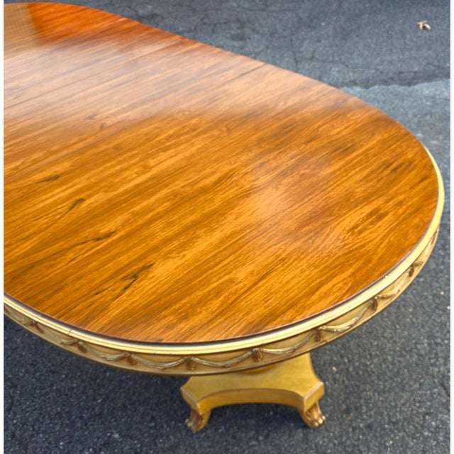 Featured is a Vintage Karges Furniture Rosewood Oval Top Neoclassical Style Oval Extending Dining Table. Striking and...