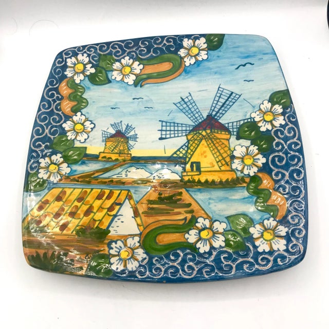 This is a stunning painted Terra Cotta platter from Trapani in Sicily, Italy. It shows the famous windmills of trapani. It...
