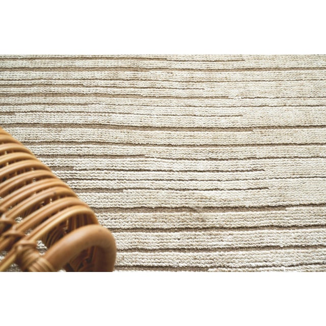 The Mixed Texture rug is hand knotted with a low nubby wool pile with a shimmer of bamboo fiber for highlights. This...