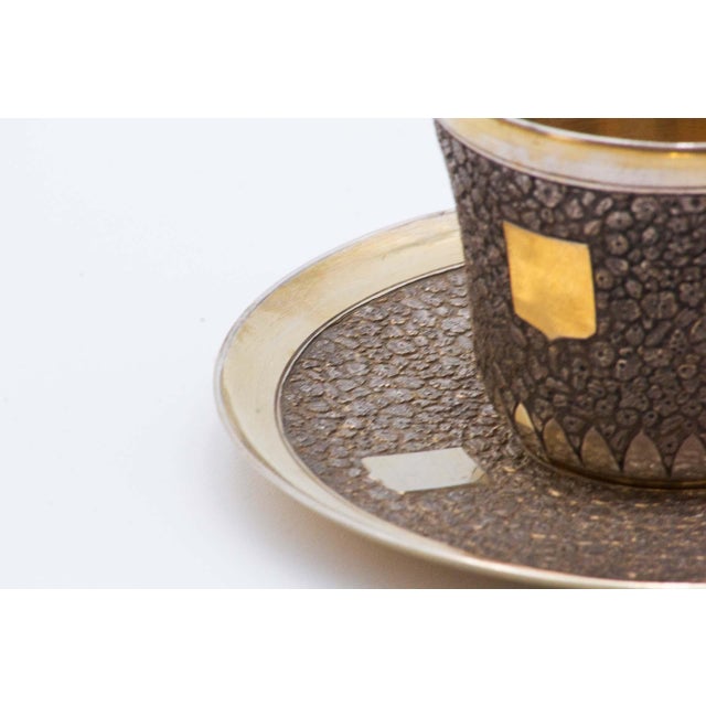 Cup and Saucer in Embossed Silver with Monogram Card, Set of 2, in Very Good conditions. Designed before 1890 This piece...