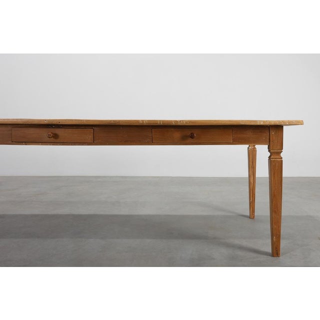 A generous and beautifully time‑worn French Provence farm table crafted in elm around 1850. This long table embodies the...