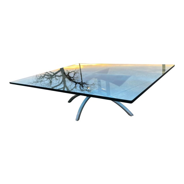Stainless steel and black powder coated steel sculptural base under heavy 3/4” thick rectangular glass custom low table,...