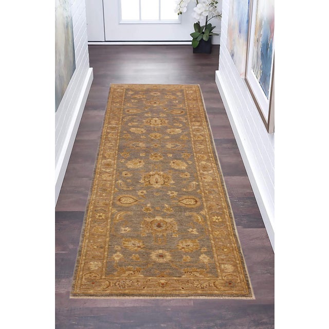 Enhance the ambiance of your home with this magnificent Persian-influenced Turkish hand-knotted rug made by skilled...