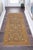 Enhance the ambiance of your home with this magnificent Persian-influenced Turkish hand-knotted rug made by skilled...