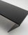 A modern and futuristic coffee table, designed with a space-age and minimalist aesthetic reminiscent of the experimental...
